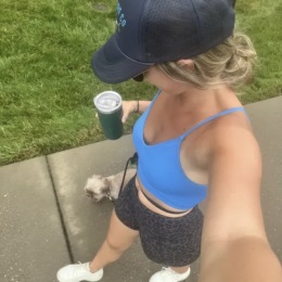 a woman walking her dog outdoors